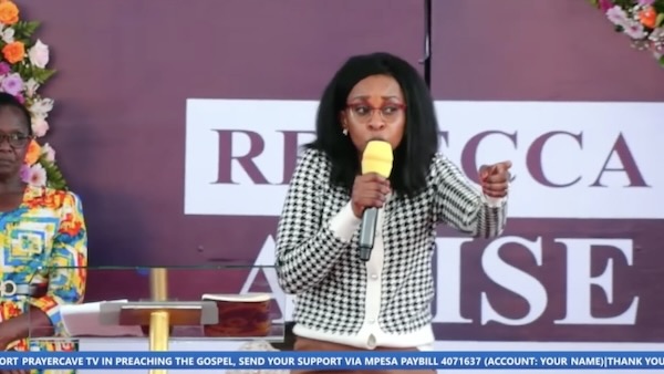 A person speaking into a microphone