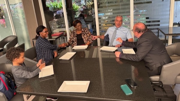 A group of people sitting around a table