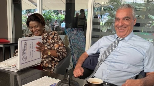 A person and person sitting at a table