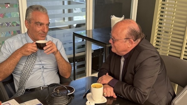 Two men sitting at a table
