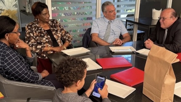 A group of people sitting around a table