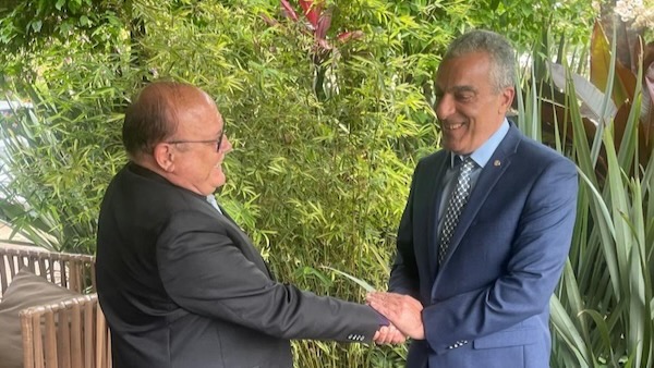 Two men in suits shaking hands