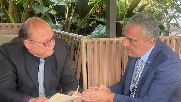 Two men sitting on a bench