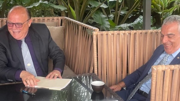 A couple of men sitting at a table