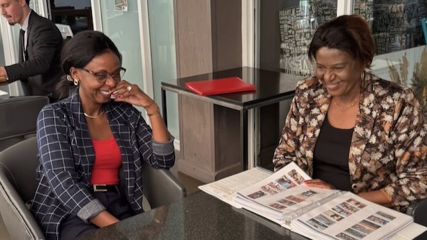 A couple of women sitting at a table