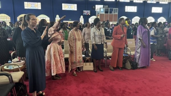 A group of people standing in a room