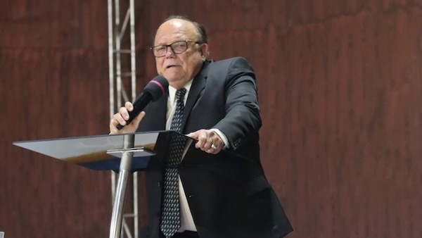 A person speaking into a microphone
