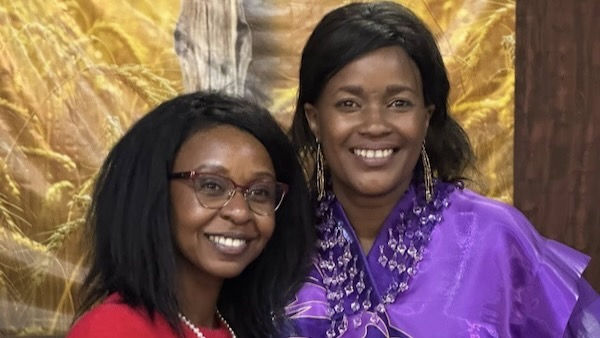 A couple of women smiling