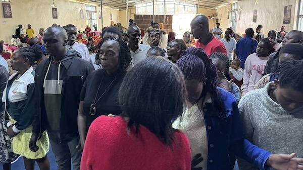 A group of people standing in a room