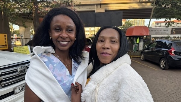 A couple of women smiling for a picture