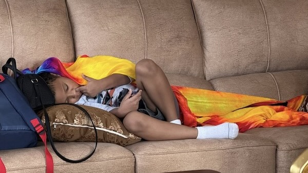 A child lying on a couch