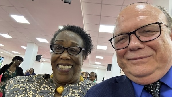 A person and person smiling for a selfie