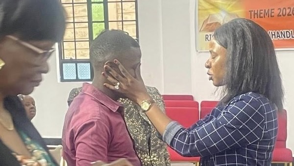 A person touching a person's face