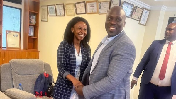 A person and person shaking hands
