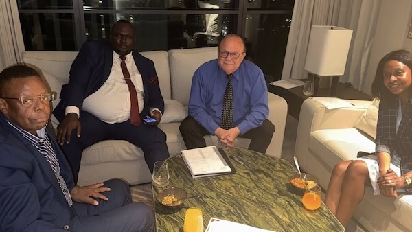 A group of men sitting on a couch
