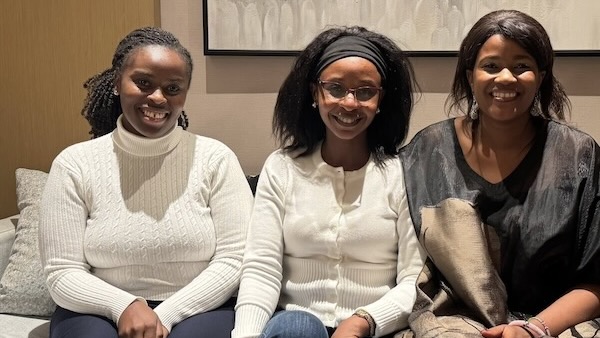A group of women sitting on a couch