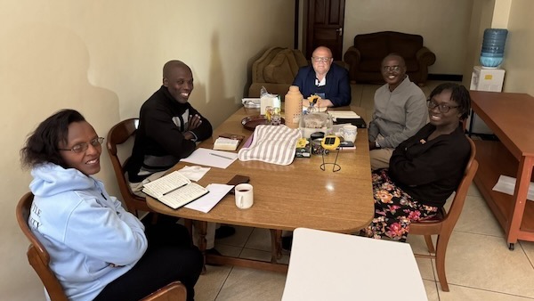 A group of people sitting at a table