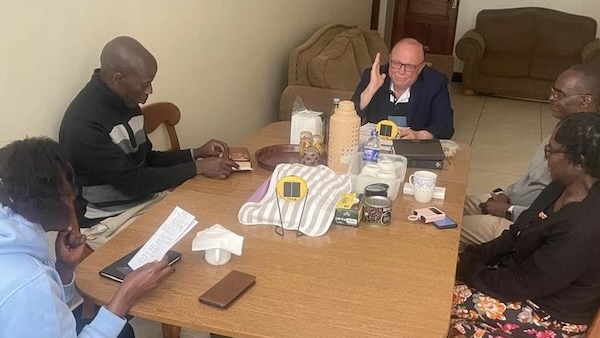 A group of men sitting at a table