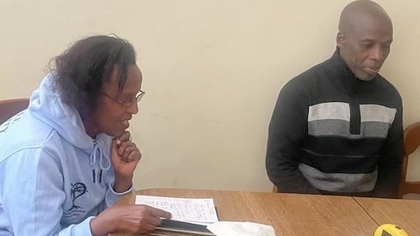 A person and person sitting at a table