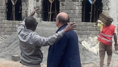 A person holding another person's hand