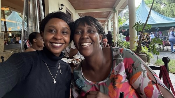 Two women smiling at the camera