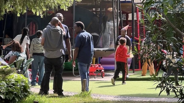A group of people standing in a park