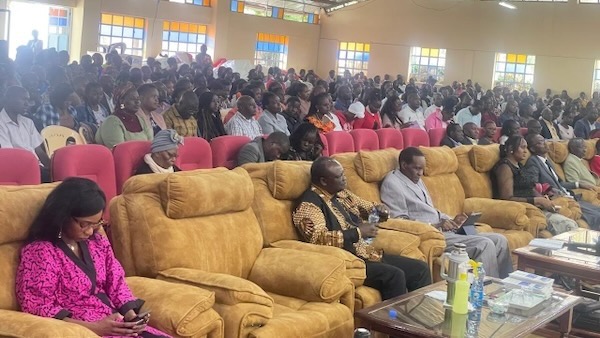 A large group of people sitting on couches