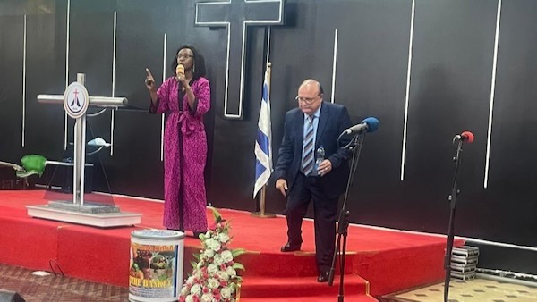 A person and person on a stage