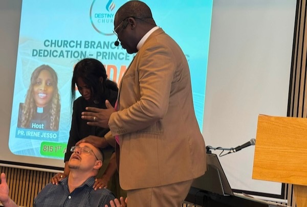 Apostle Towongo praying over Luger Jesso