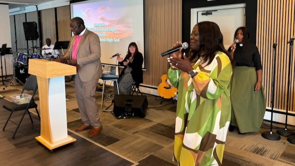 Pastor Theodora worshipping during ordination