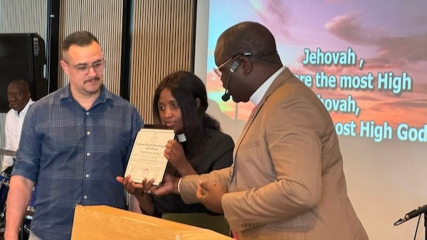 Dr. Towongo presenting the ordination certificate